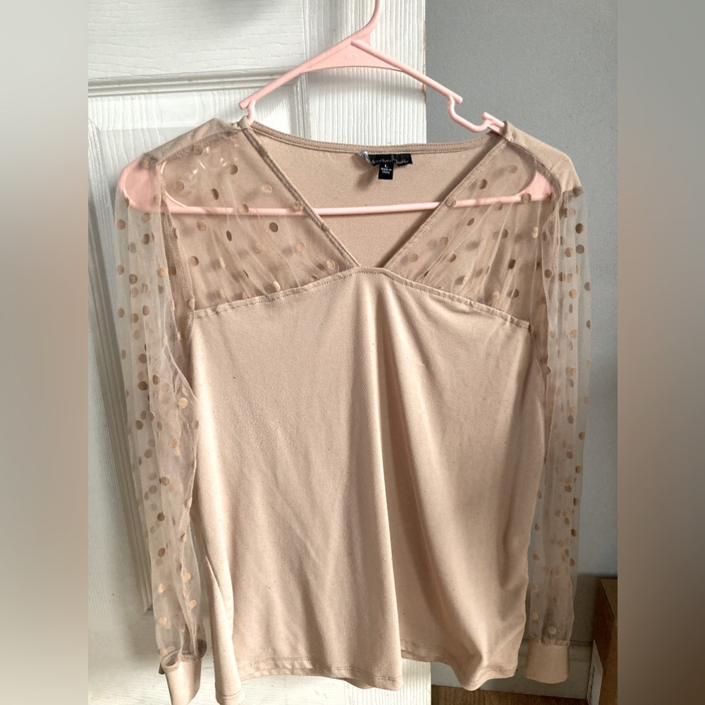 Figure flattering blouse.